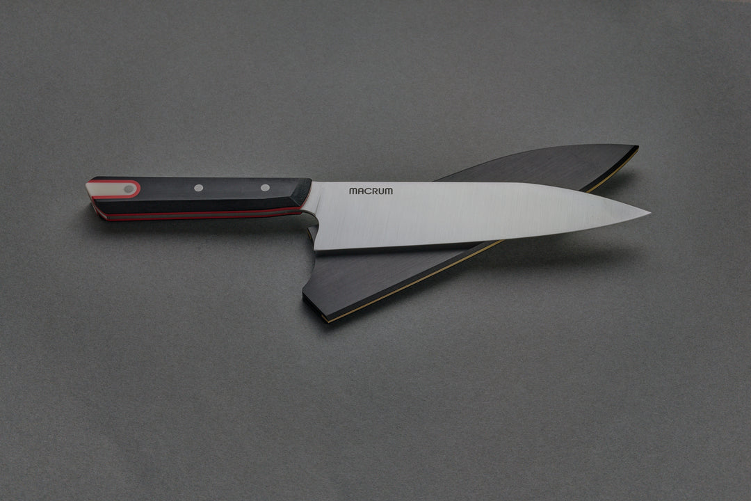 184 mm Burnside Chef out of its saya, lying across it