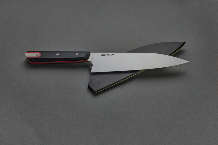 184 mm Burnside Chef out of its saya, lying across it