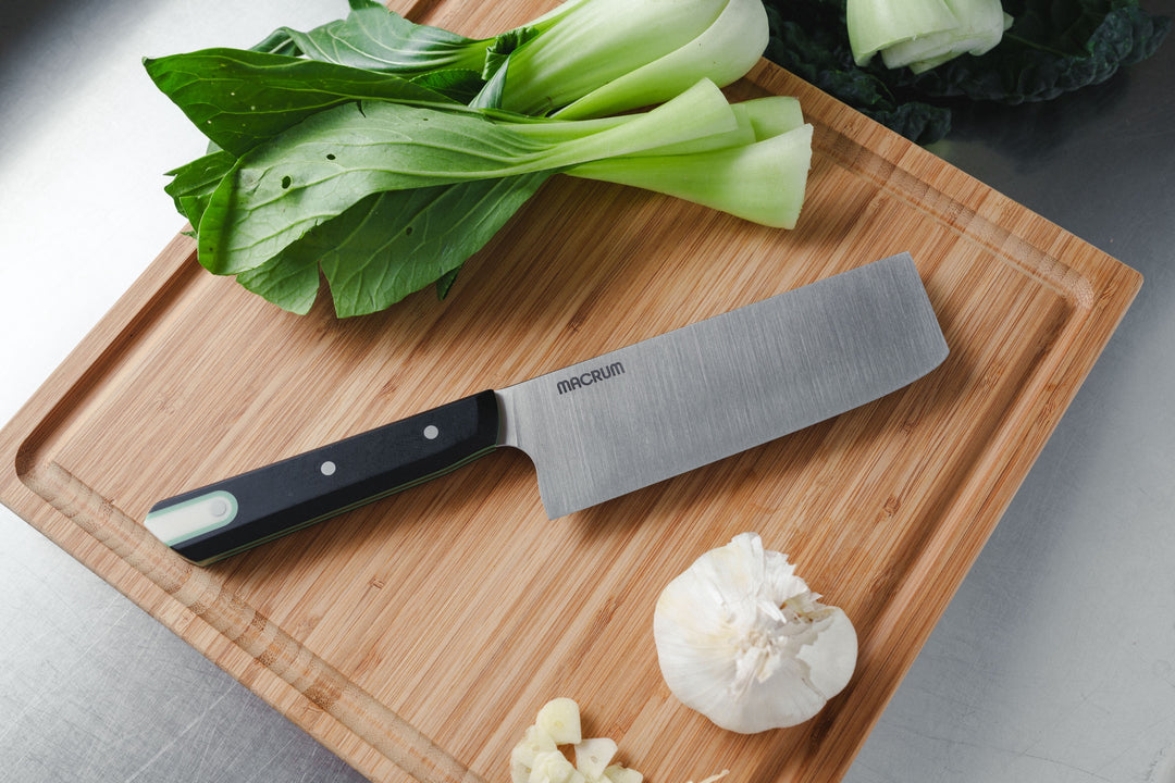 152 mm St. Johns Vegetable on a cutting board with bok choy and garlic
